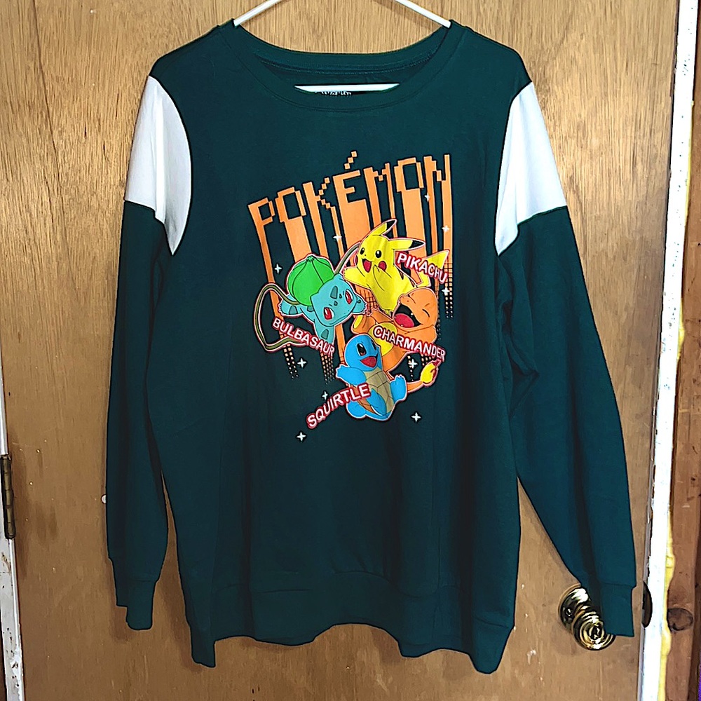New, unworn, without tags, 2X Torrid Pokémon green and white crew neck.